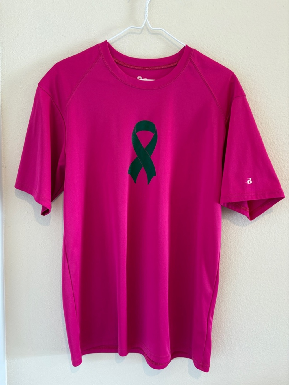 Pink dri fit T-Shirt w/ short sleeves & Ribbon for breast cancer awareness